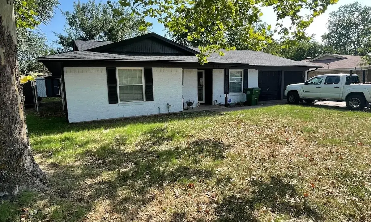 Professional roofing crew working on a residential roof in Edgewood